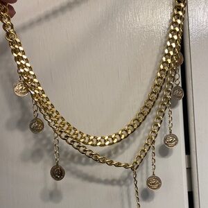 Gold two swag chain belt with coins.